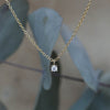 petite round cut diamond necklace