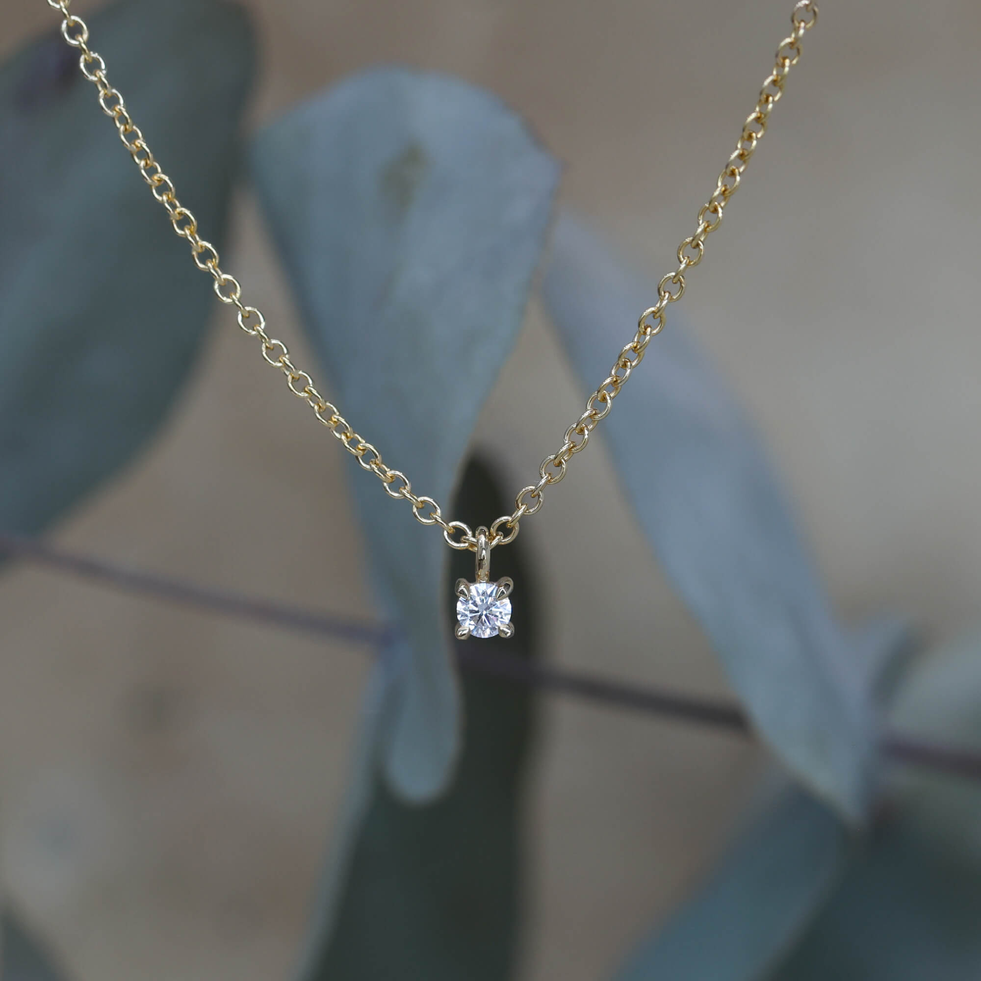 petite round cut diamond necklace