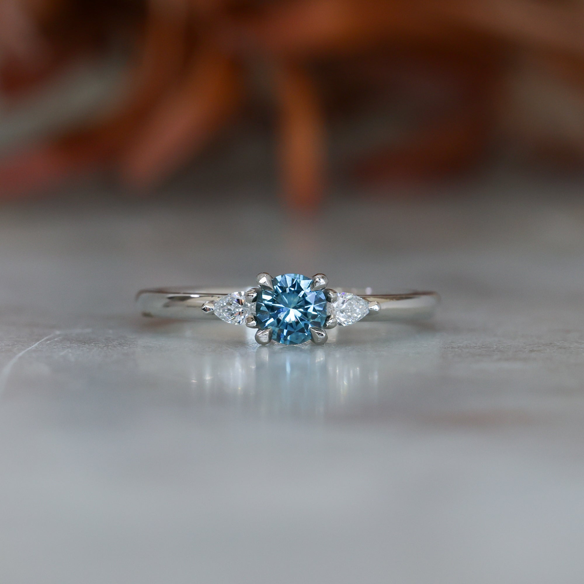 0.37ct Round Cut Montana Sapphire and Pear Diamond Engagement ring