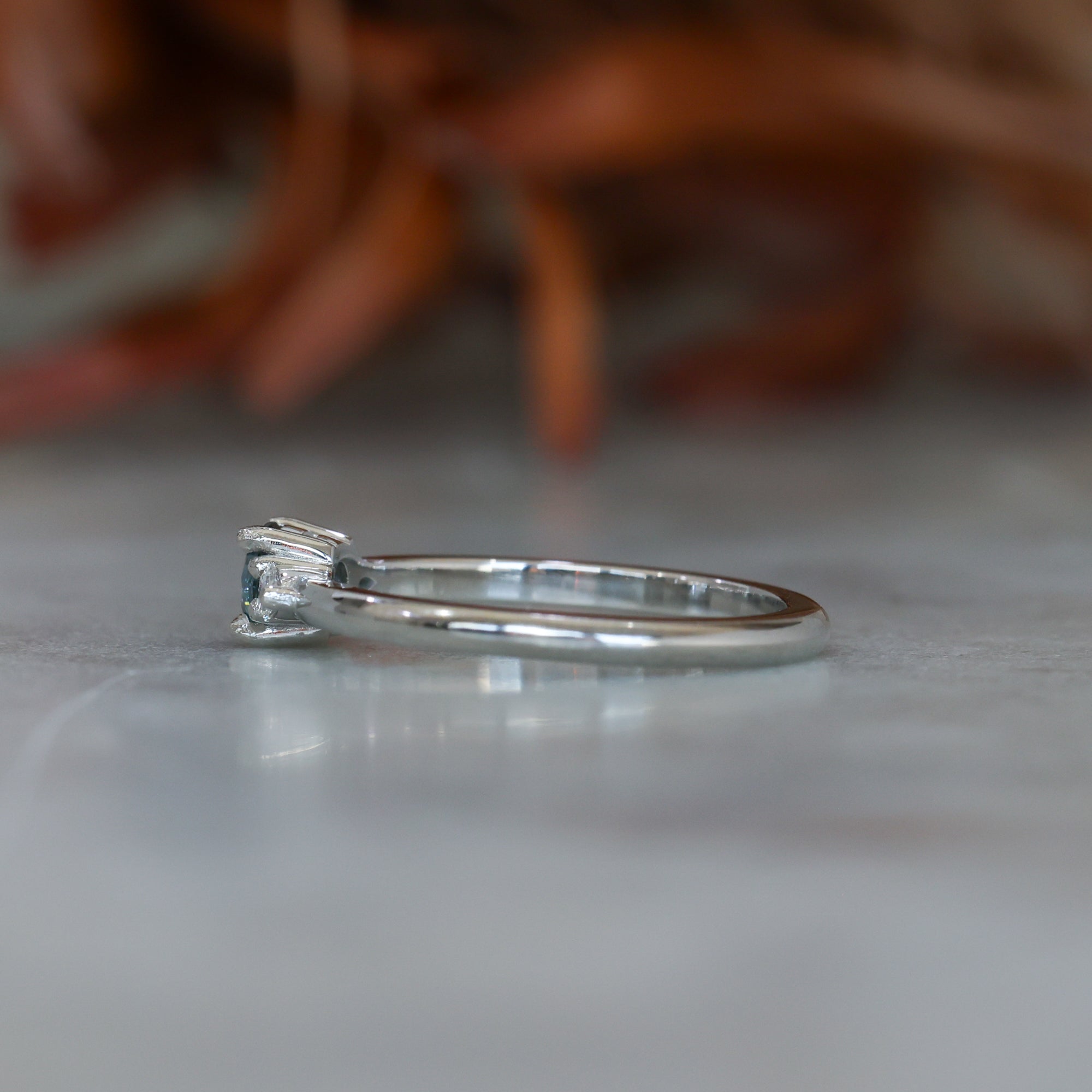 0.37ct Round Cut Montana Sapphire and Pear Diamond Engagement ring in platinum band