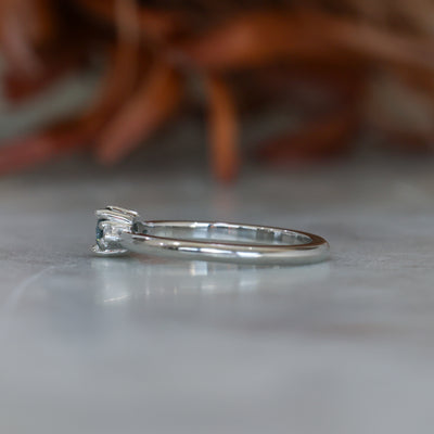 0.37ct Round Cut Montana Sapphire and Pear Diamond Engagement ring in platinum band