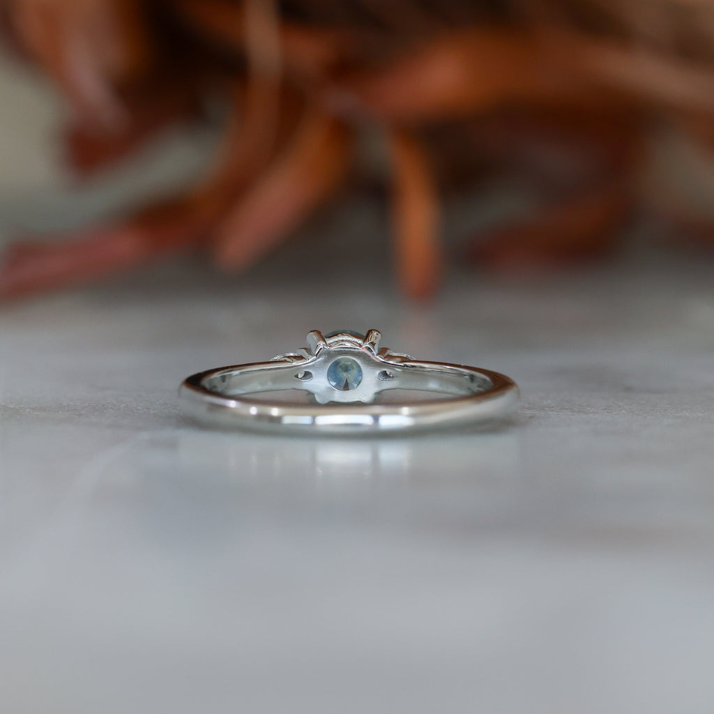 0.37ct Round Cut Montana Sapphire and Pear Diamond Engagement ring in platinum band