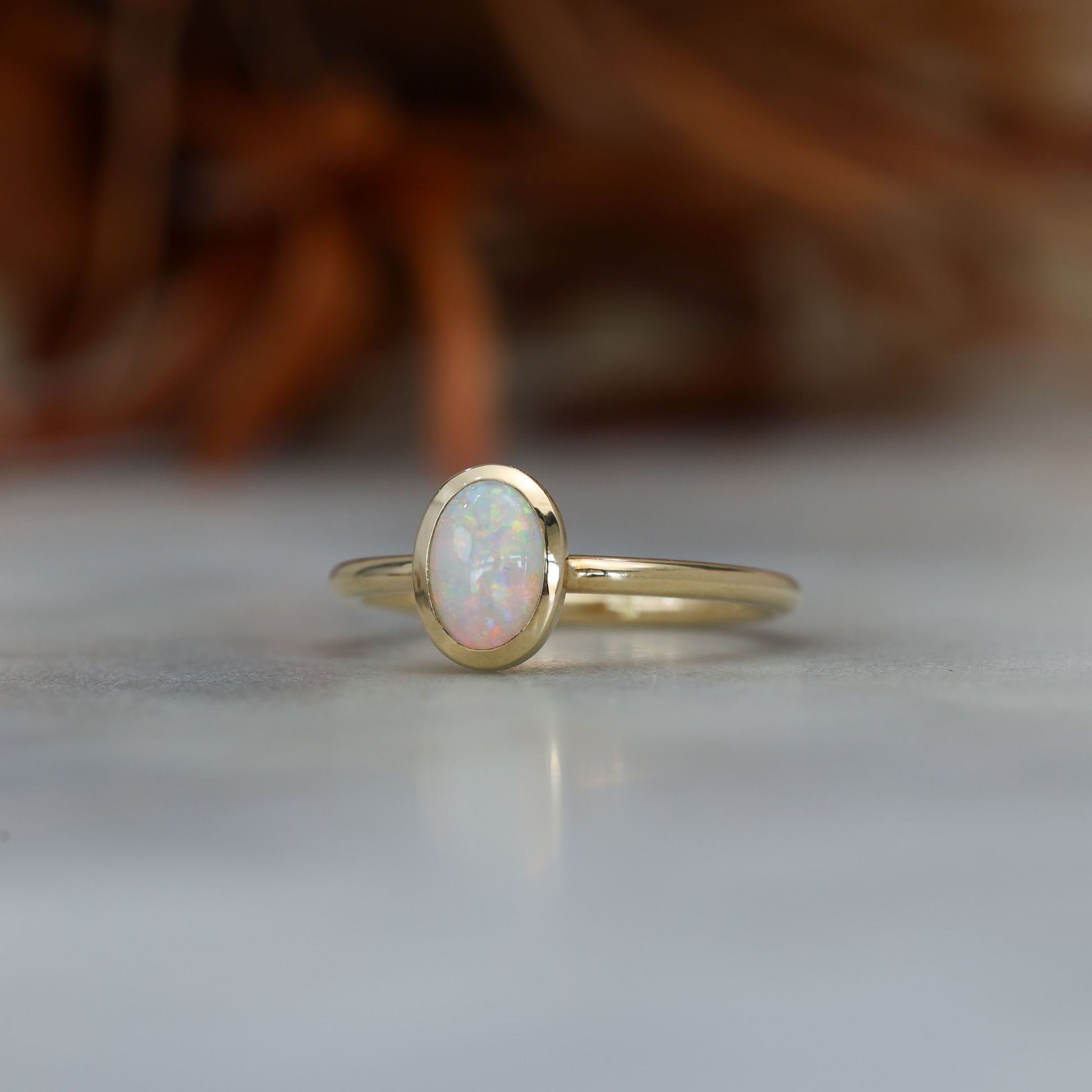 0.43ct opal bezel ring yellow gold