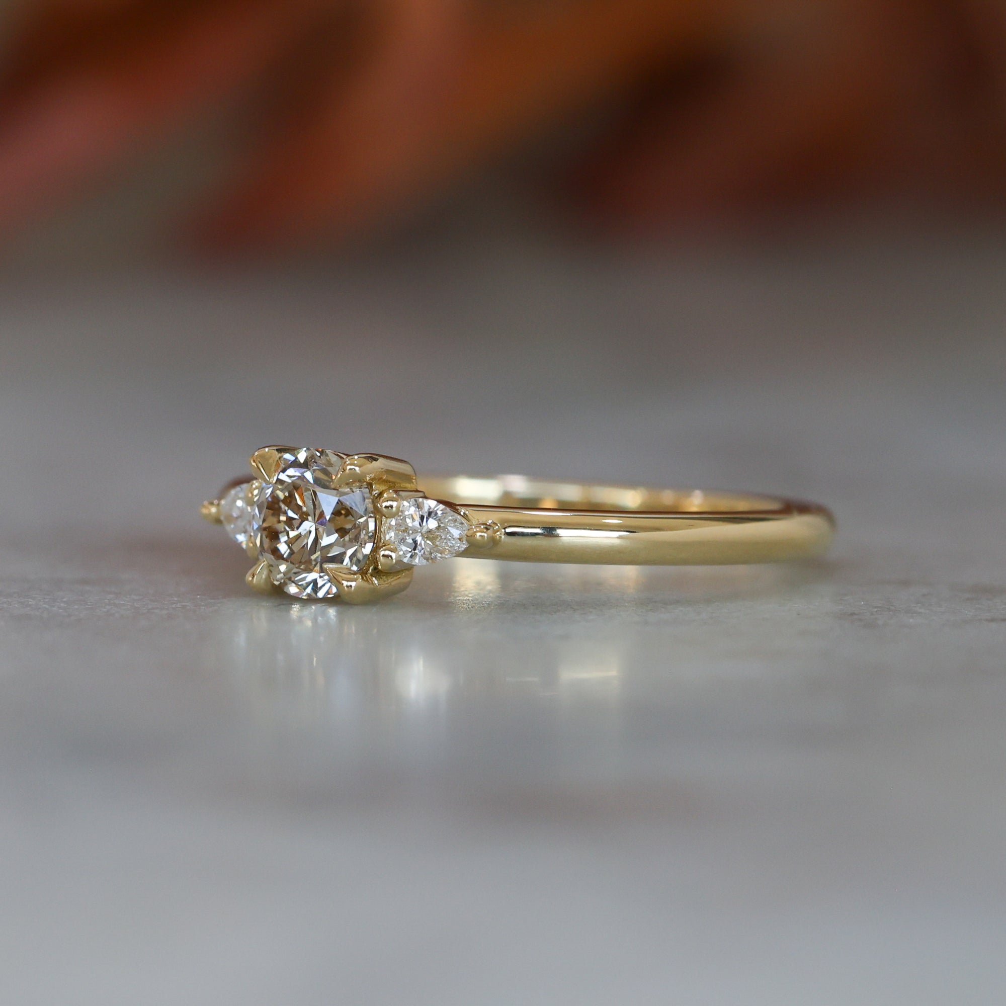 0.46ct Piccolo May trilogy Champagne Diamond engagement ring side view of ring