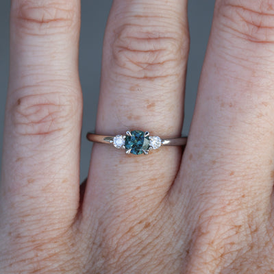 0.46ct round cut australian parti sapphire trilogy engagement ring on hand