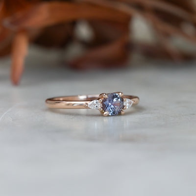 0.47ct Montana Sapphire trilogy engagement ring side view rose gold band