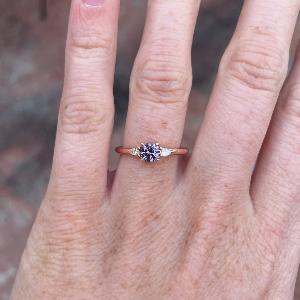 0.47ct Montana Sapphire trilogy engagement ring on hand