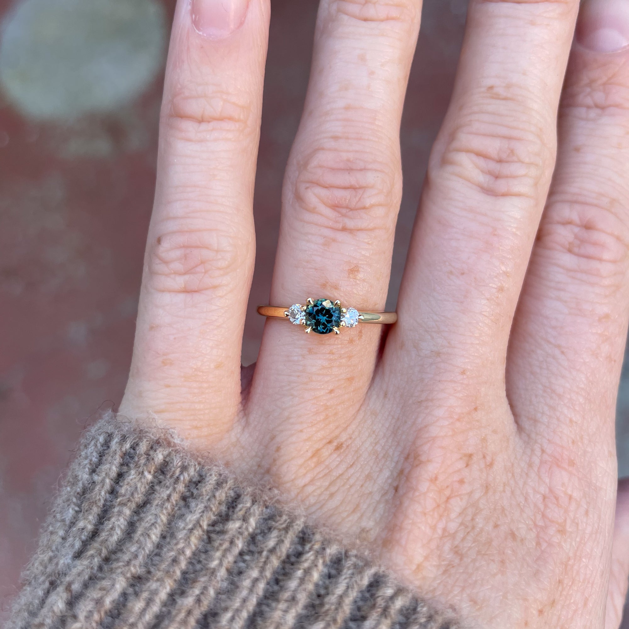 0.50ct Australian Parti Sapphire engagement ring on hand