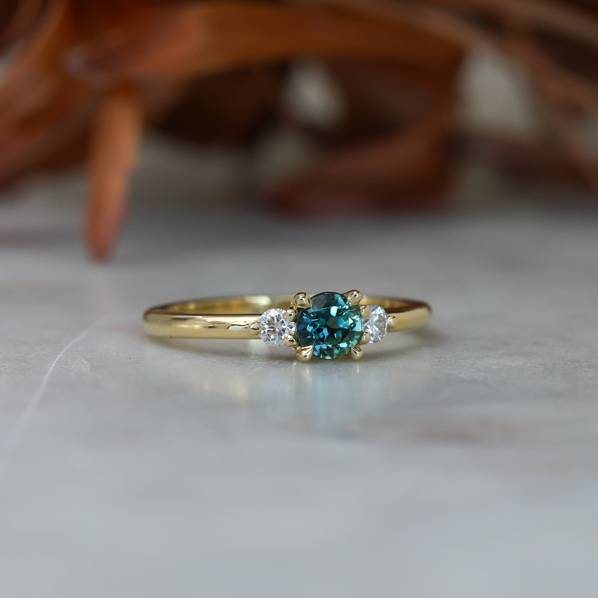 0.50ct Australian Parti Sapphire and diamond trilogy engagement ring in a 18 yellow gold band