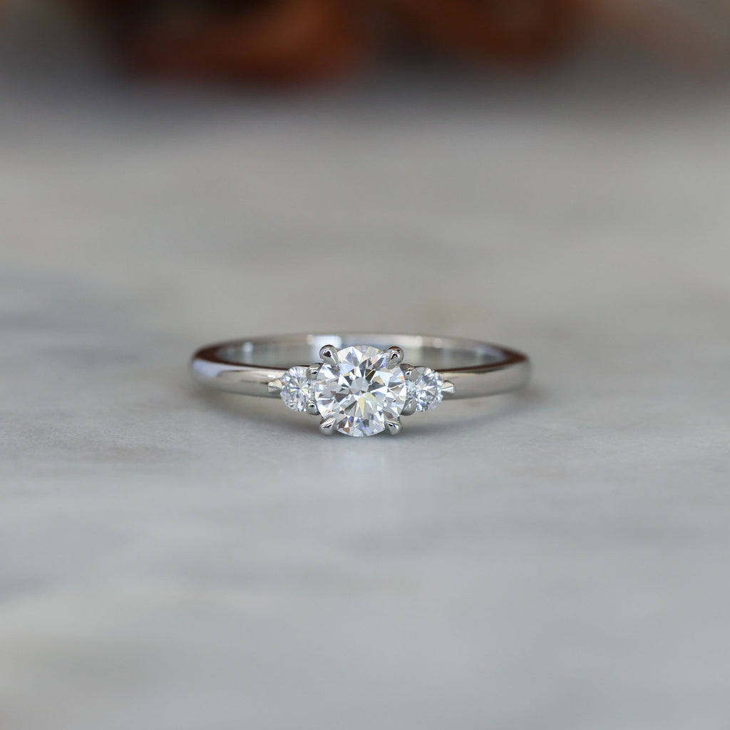 0.50ct round cut lunar trilogy engagement ring in platinum