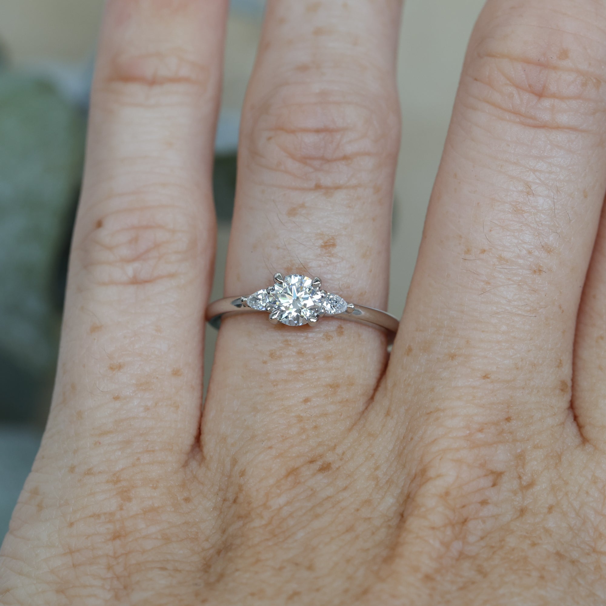 0.52ct Diamond and platinum engagement ring on hand