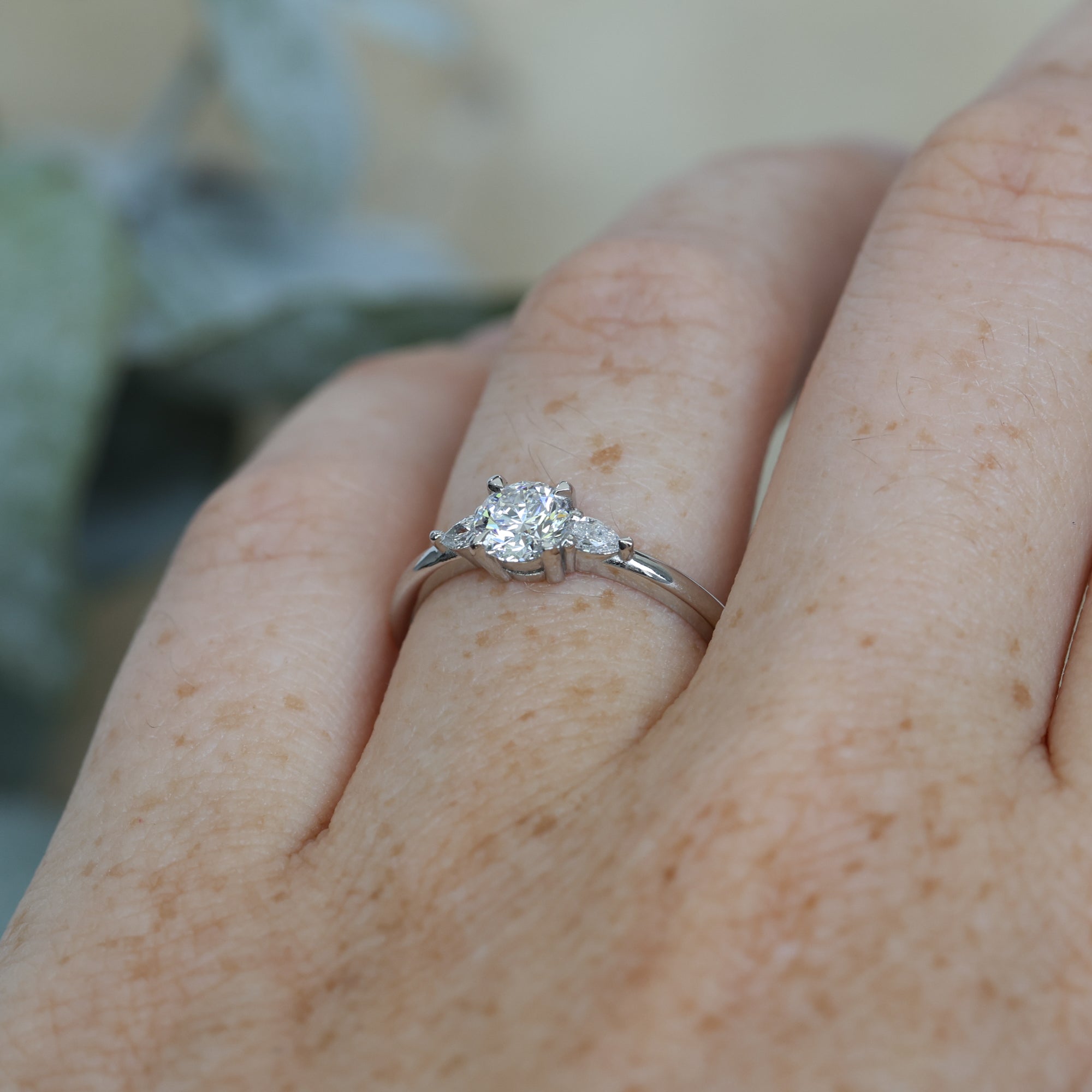 0.52ct Diamond and platinum engagement ring on hand profile
