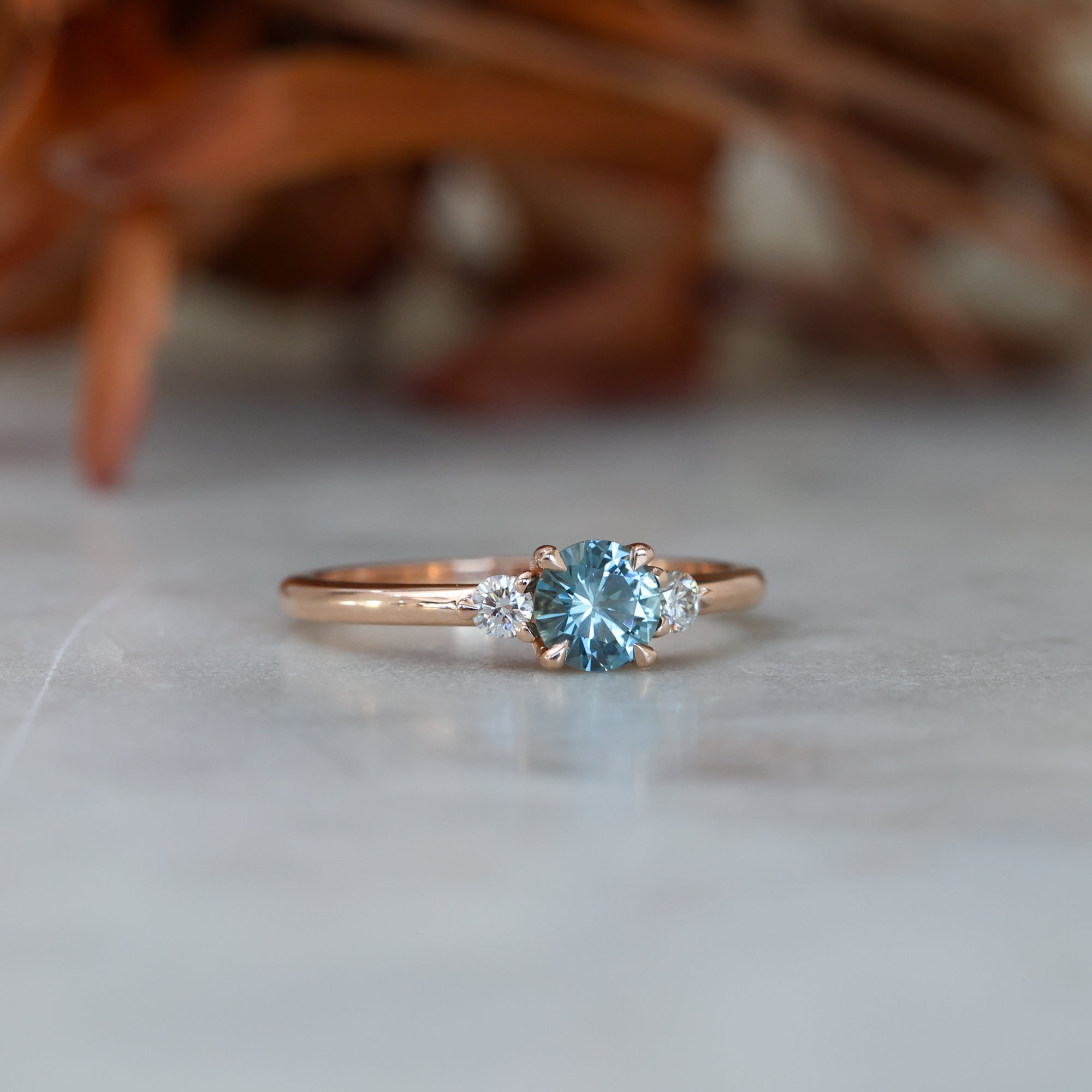 0.58ct Montana Sapphire and diamond trilogy engagement ring