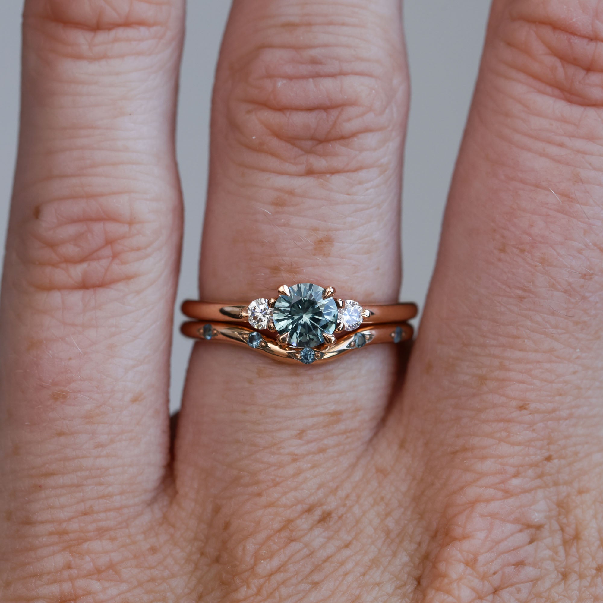 0.58ct Montana Sapphire trilogy engagement ring with wedding band