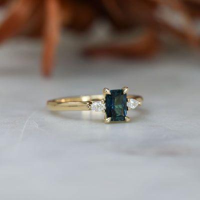 0.66ct Emerald cut australian sapphire trilogy engagement ring side