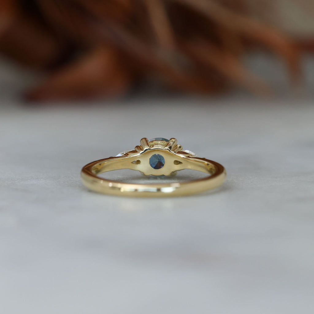 0.67ct Montana Sapphire and diamond May trilogy engagement ring back