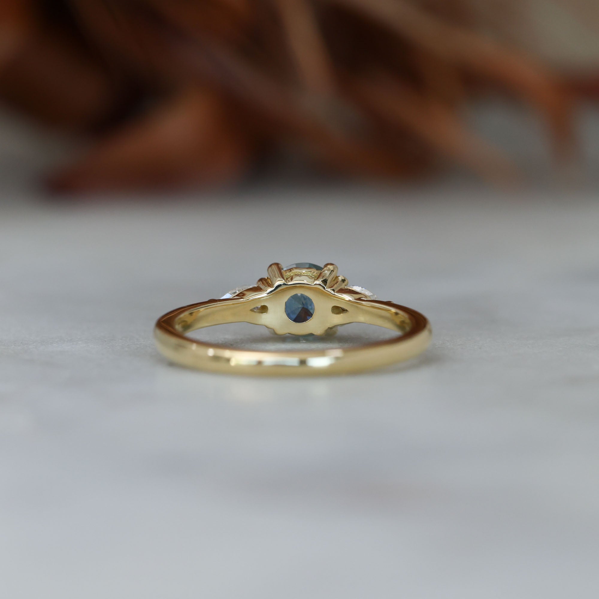 0.67ct Montana Sapphire and diamond May trilogy engagement ring back