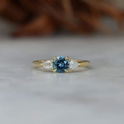 0.67ct Montana Sapphire and diamond May trilogy engagement ring