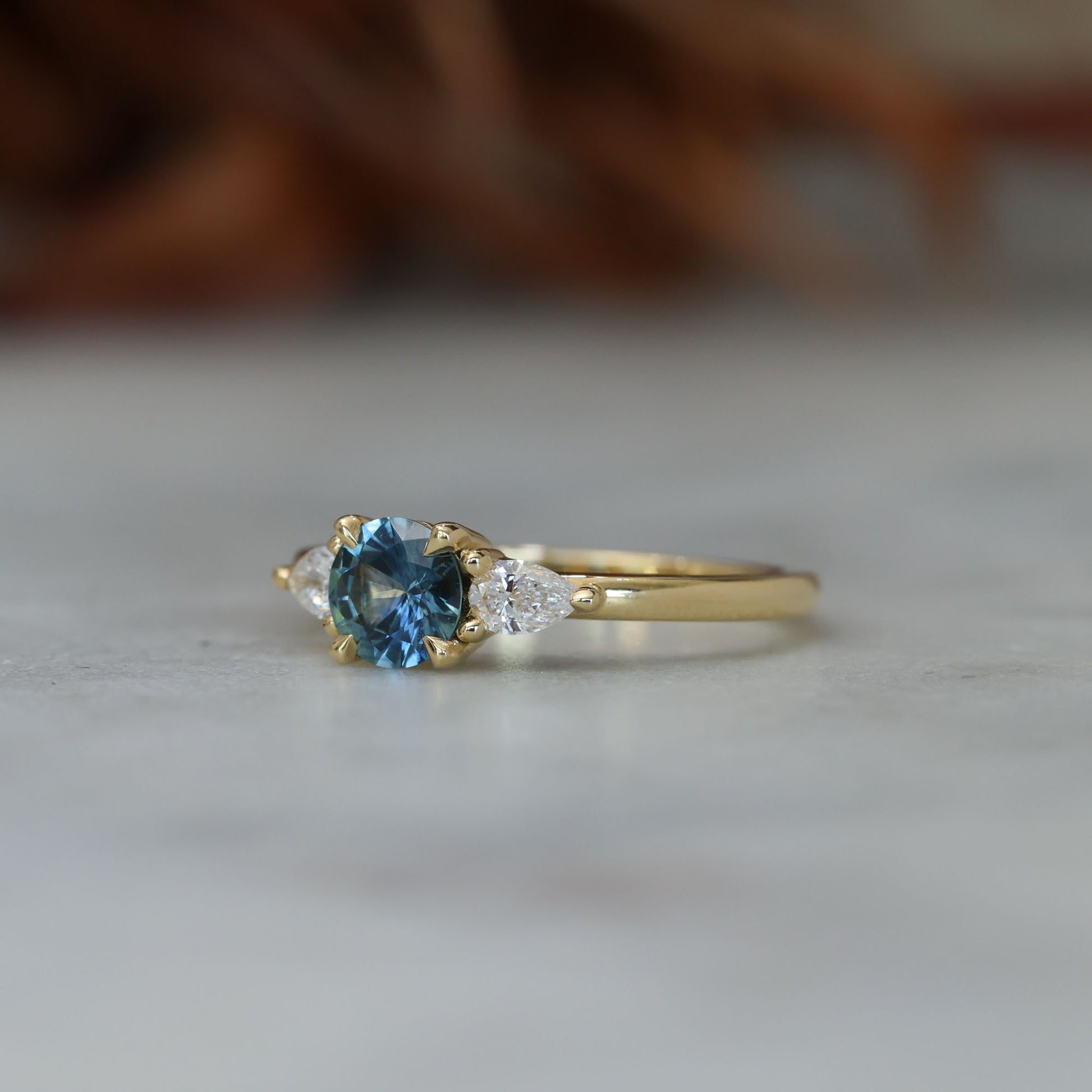 0.67ct Montana Sapphire and diamond May trilogy engagement ring