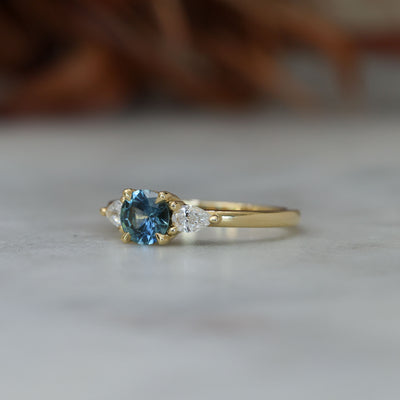 0.67ct Montana Sapphire and diamond May trilogy engagement ring