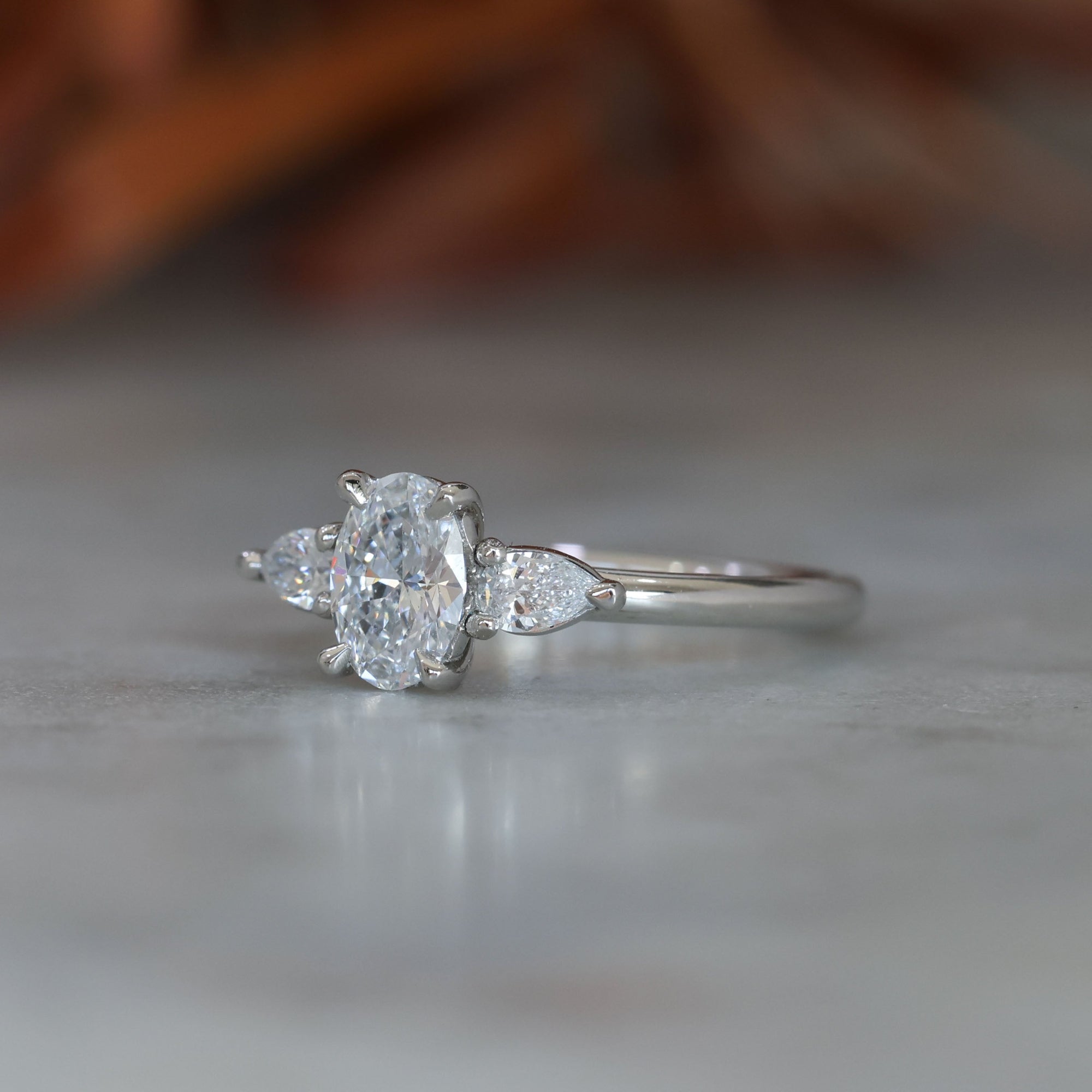 0.72ct Oval Cut Trilogy Platinum engagement ring