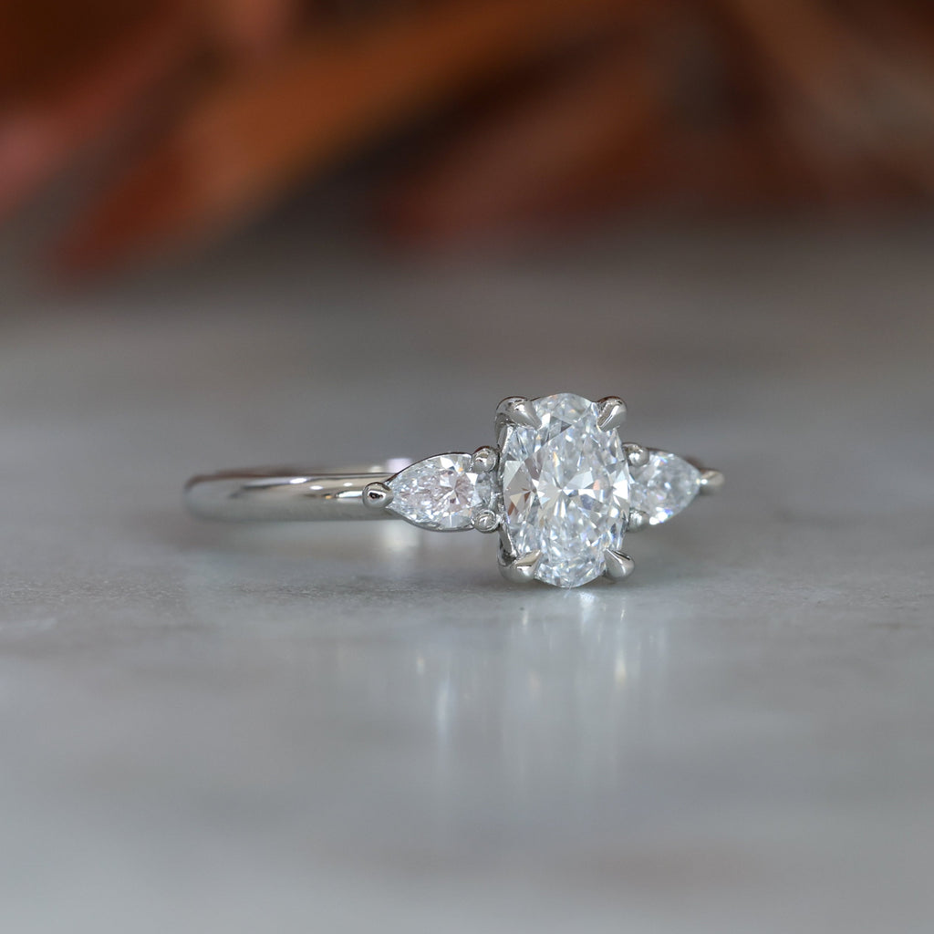 0.72ct Oval Cut Trilogy Platinum engagement ring