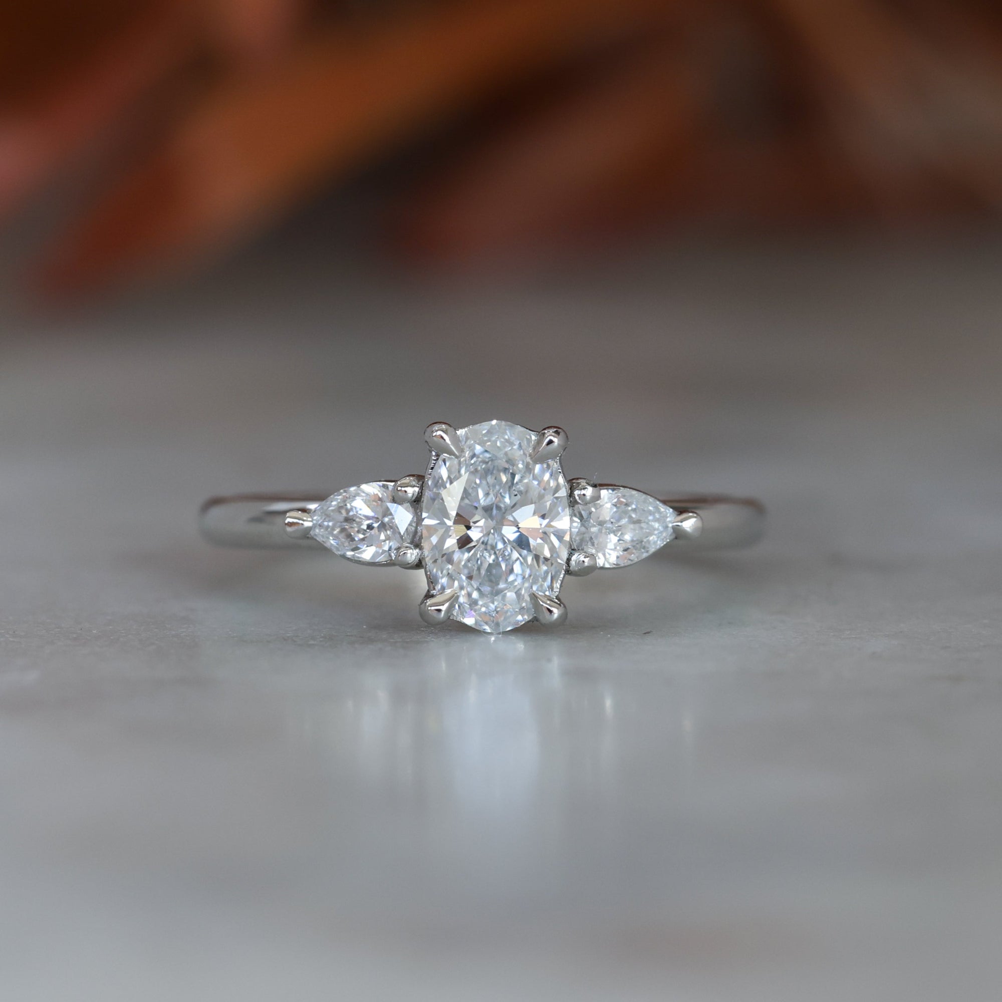 0.72ct Oval Cut Trilogy Platinum engagement ring
