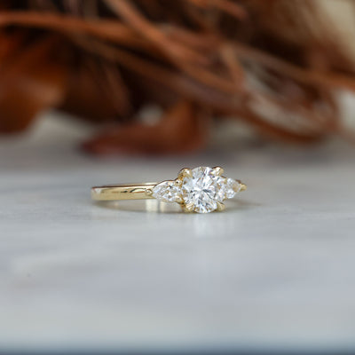 0.80ct round cut diamond may trilogy engagement ring