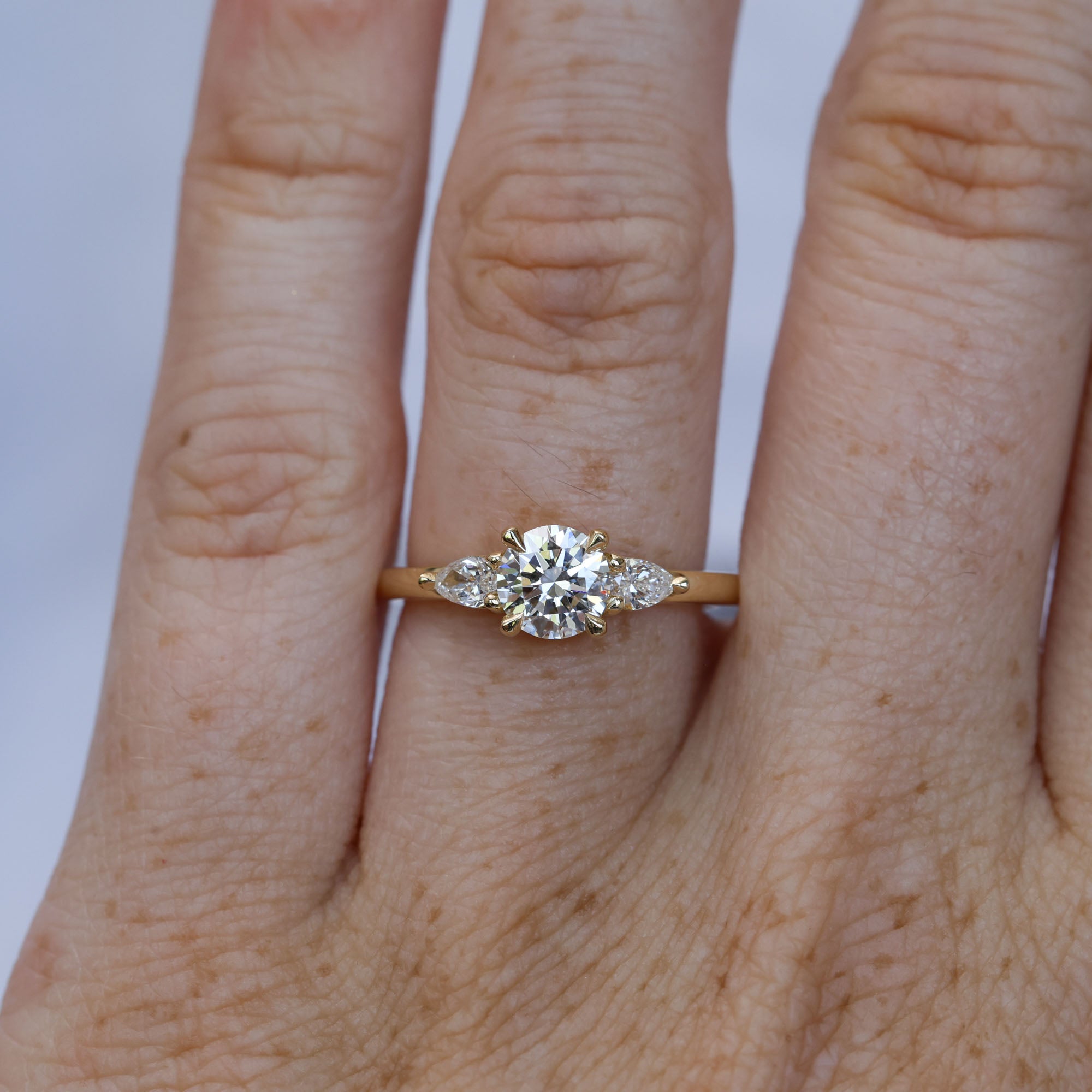 0.80ct round cut diamond may trilogy engagement ring