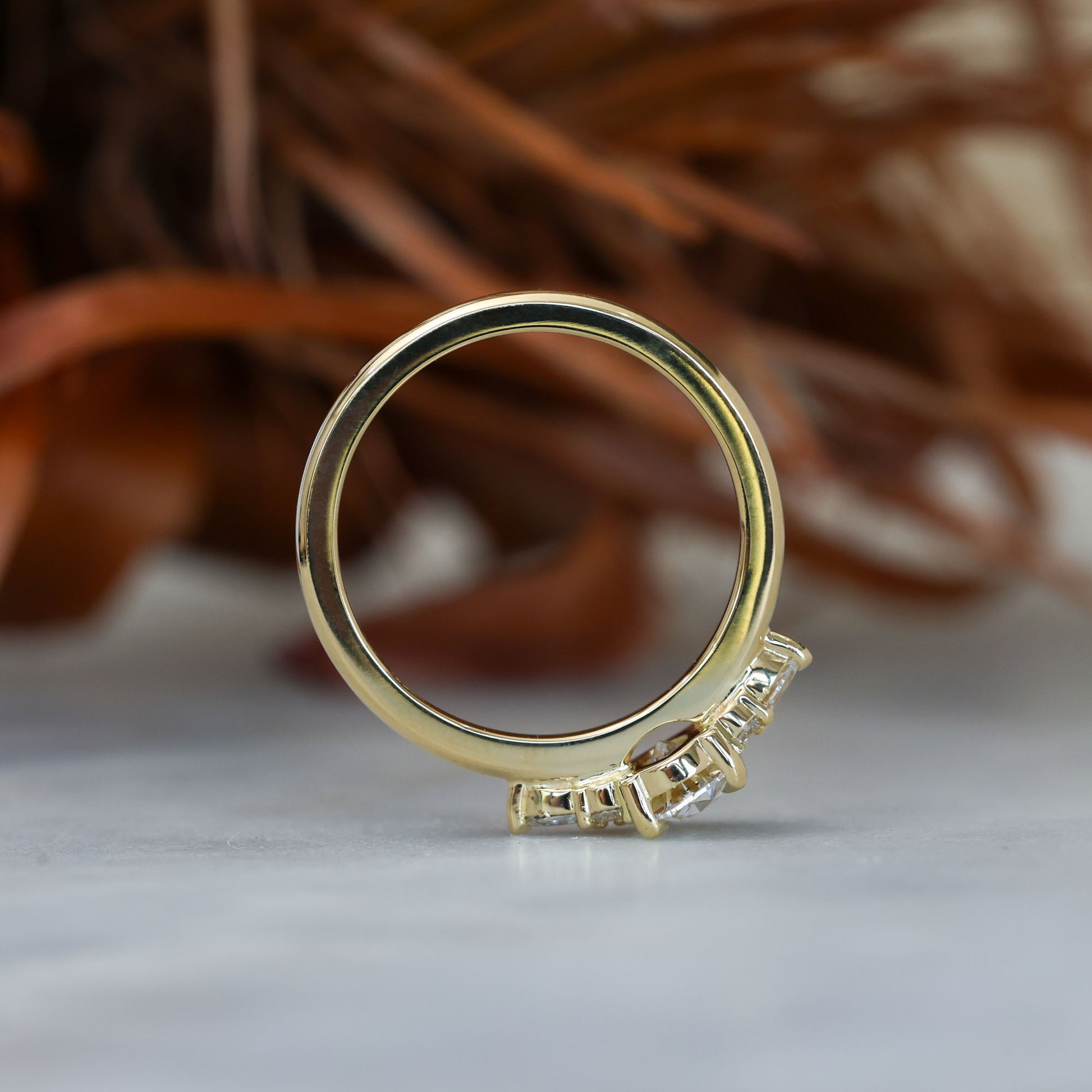 0.81ct oval cut diamond engagement ring with 6 side diamond profile