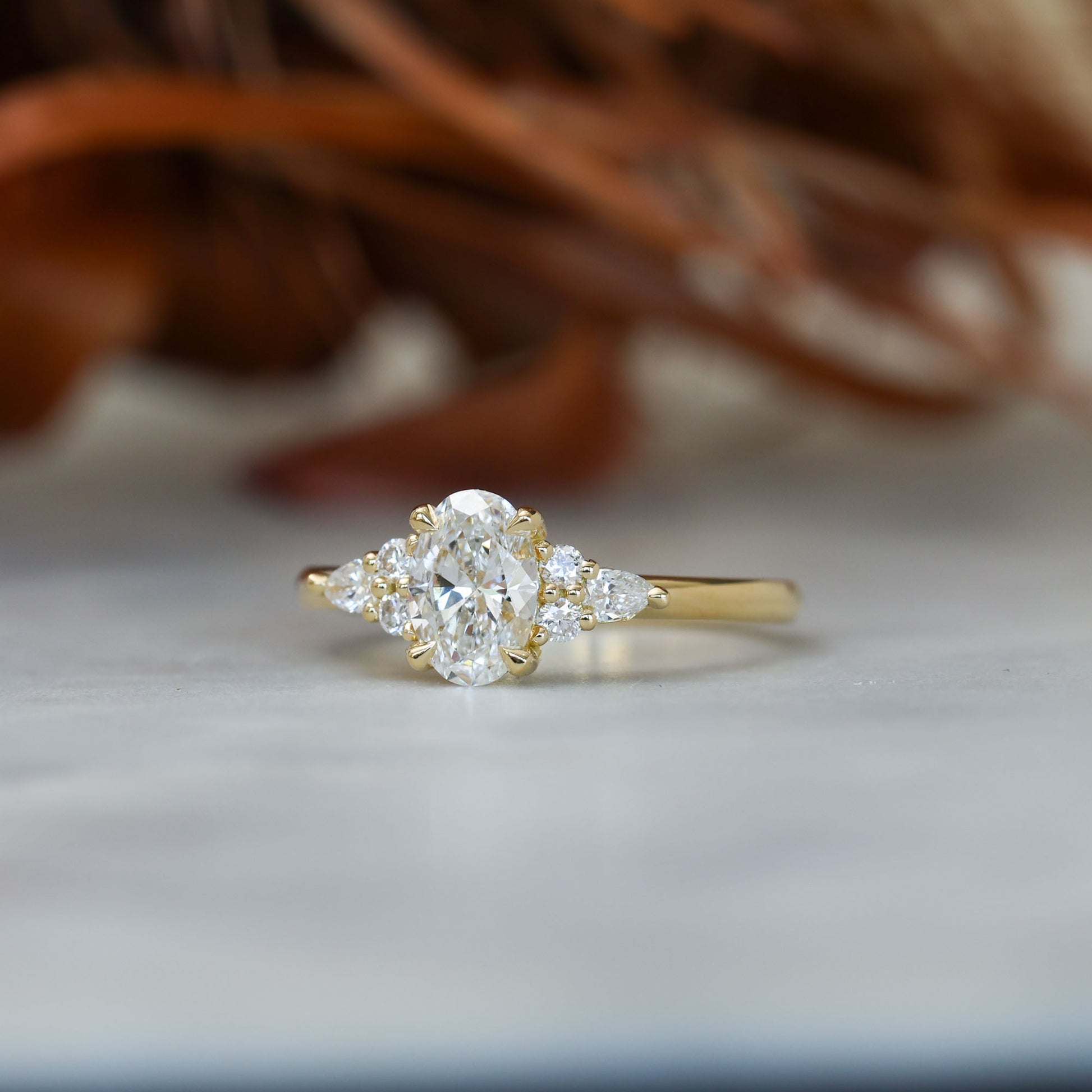 0.81ct oval cut diamond engagement ring with 6 side diamond side profile