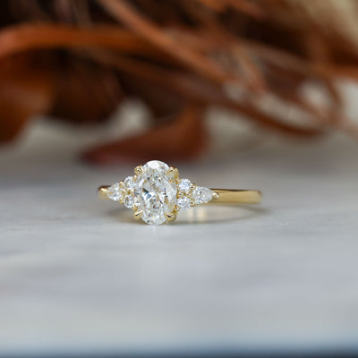 0.81ct oval cut diamond engagement ring with 6 side diamond side profile