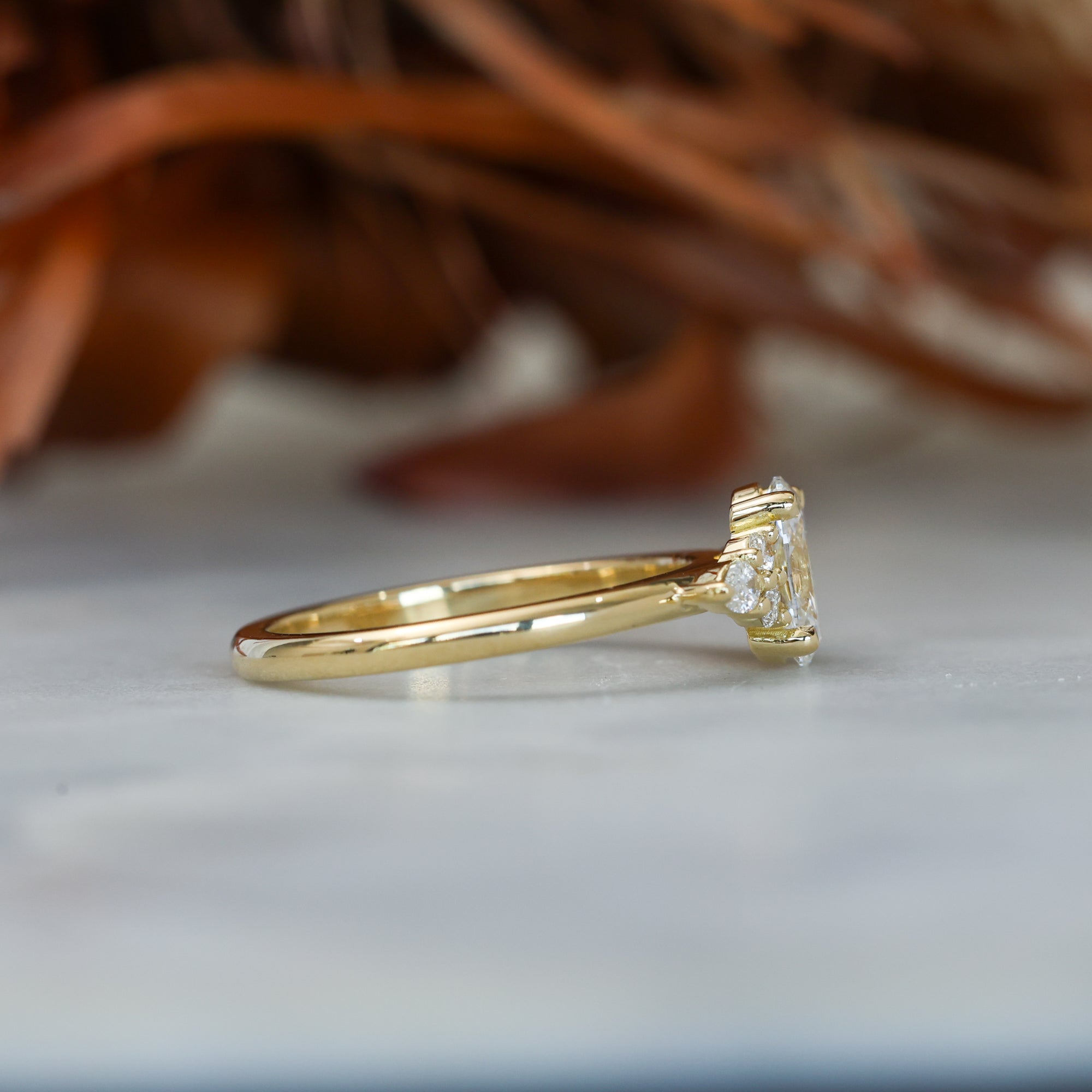 0.81ct oval cut diamond engagement ring with 6 side diamond on hand