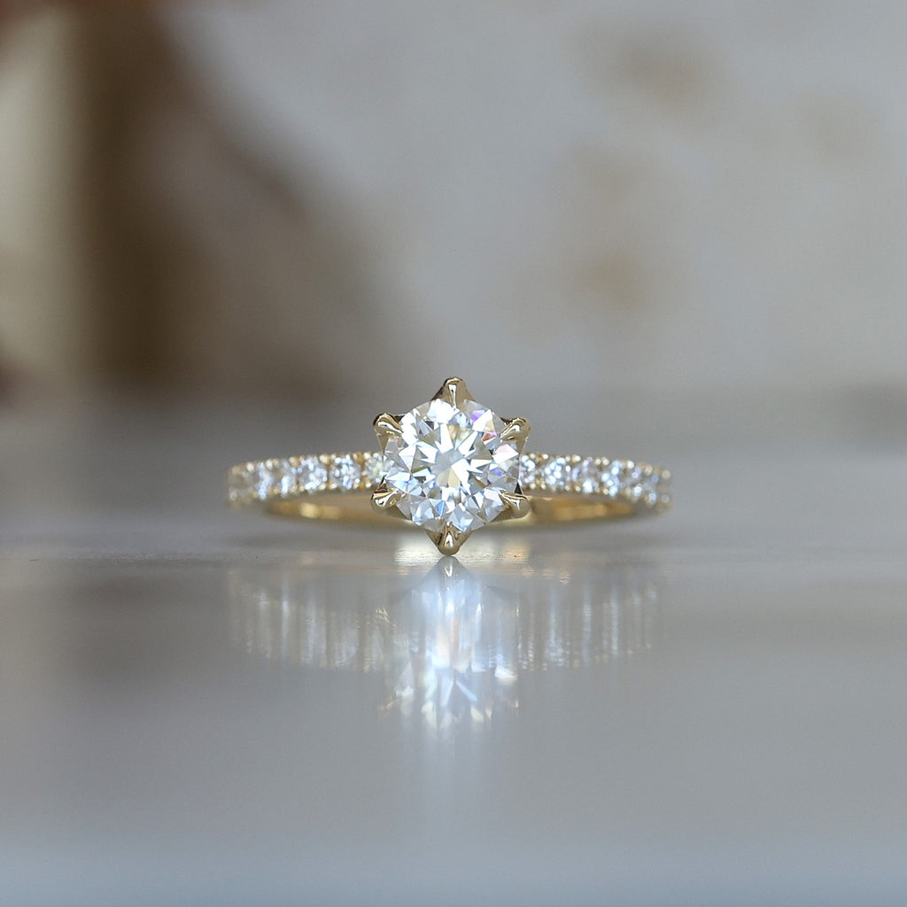 0.82ct round cut diamond engagement ring with diamond pave band