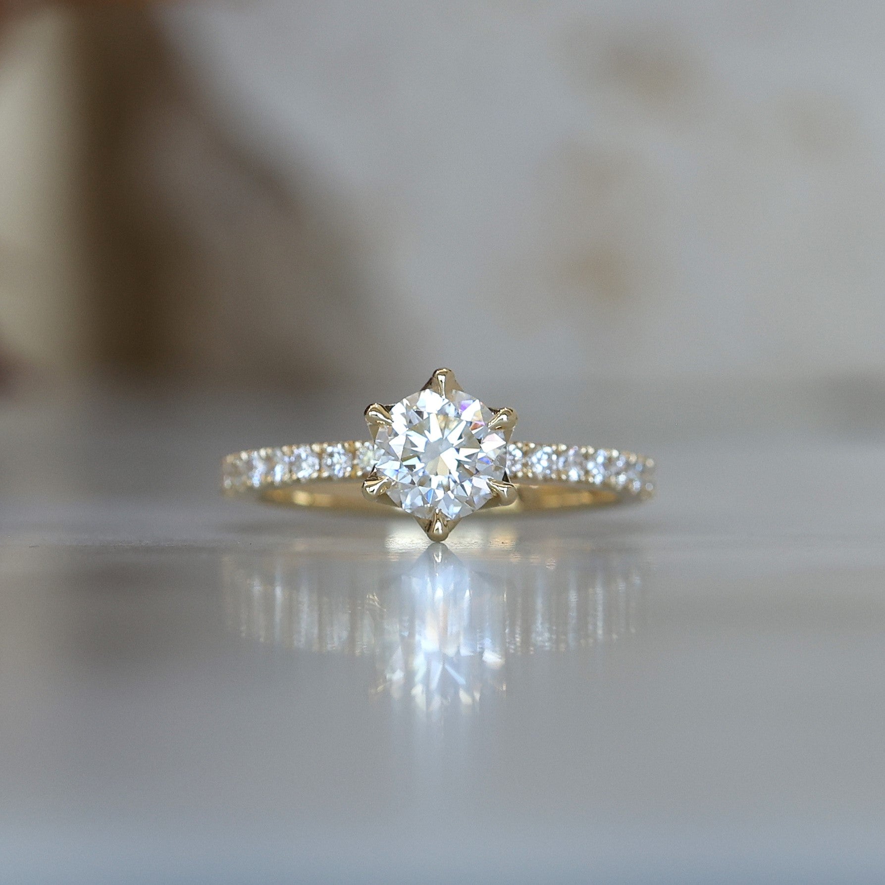 0.82ct round cut diamond engagement ring with diamond pave band