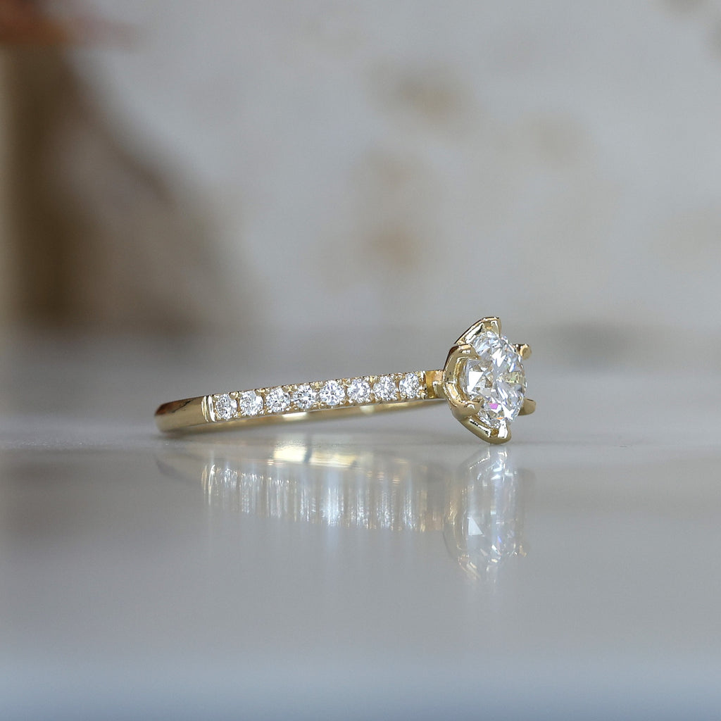 0.82ct round cut diamond engagement ring with diamond pave band side