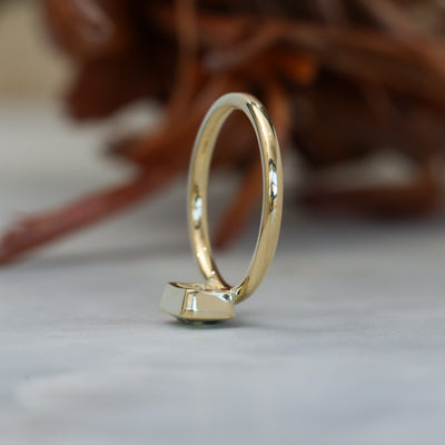 0.84ct emerald cut australian parti sapphire offset bezel engagement ring profile