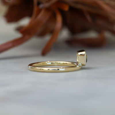 0.84ct emerald cut australian parti sapphire offset bezel engagement ring side