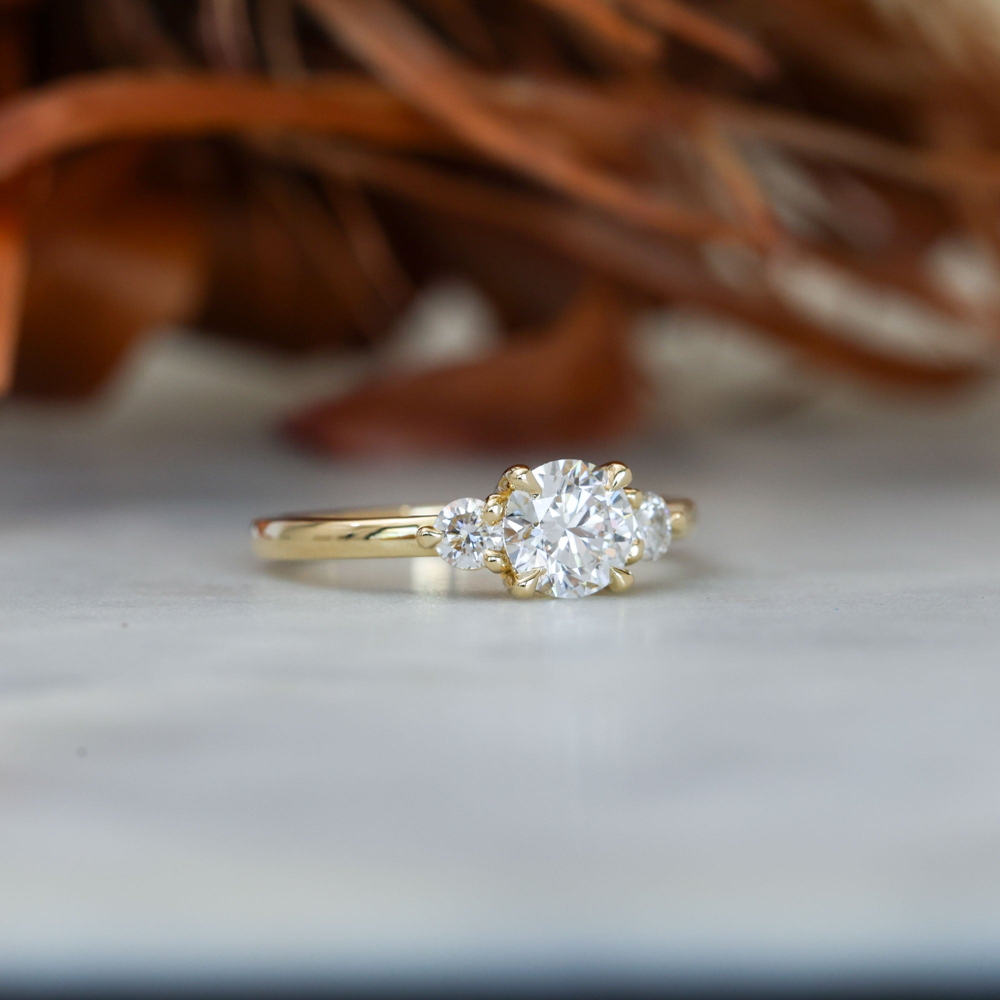 0.84ct round cut diamond trilogy engagement ring