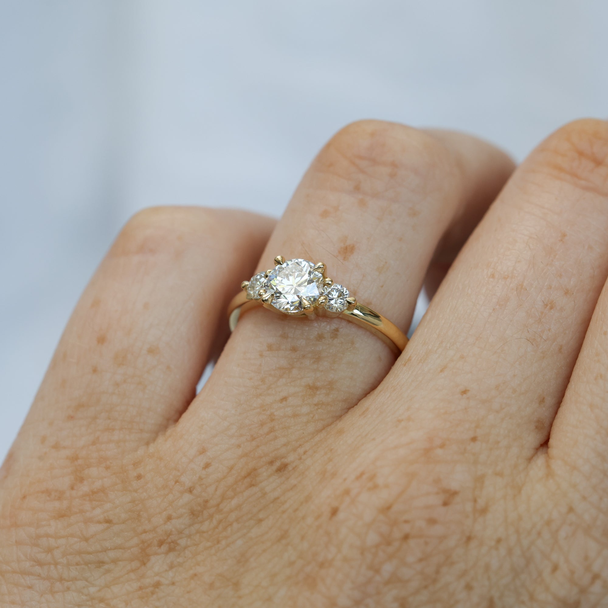 0.84ct round cut diamond trilogy engagement ring