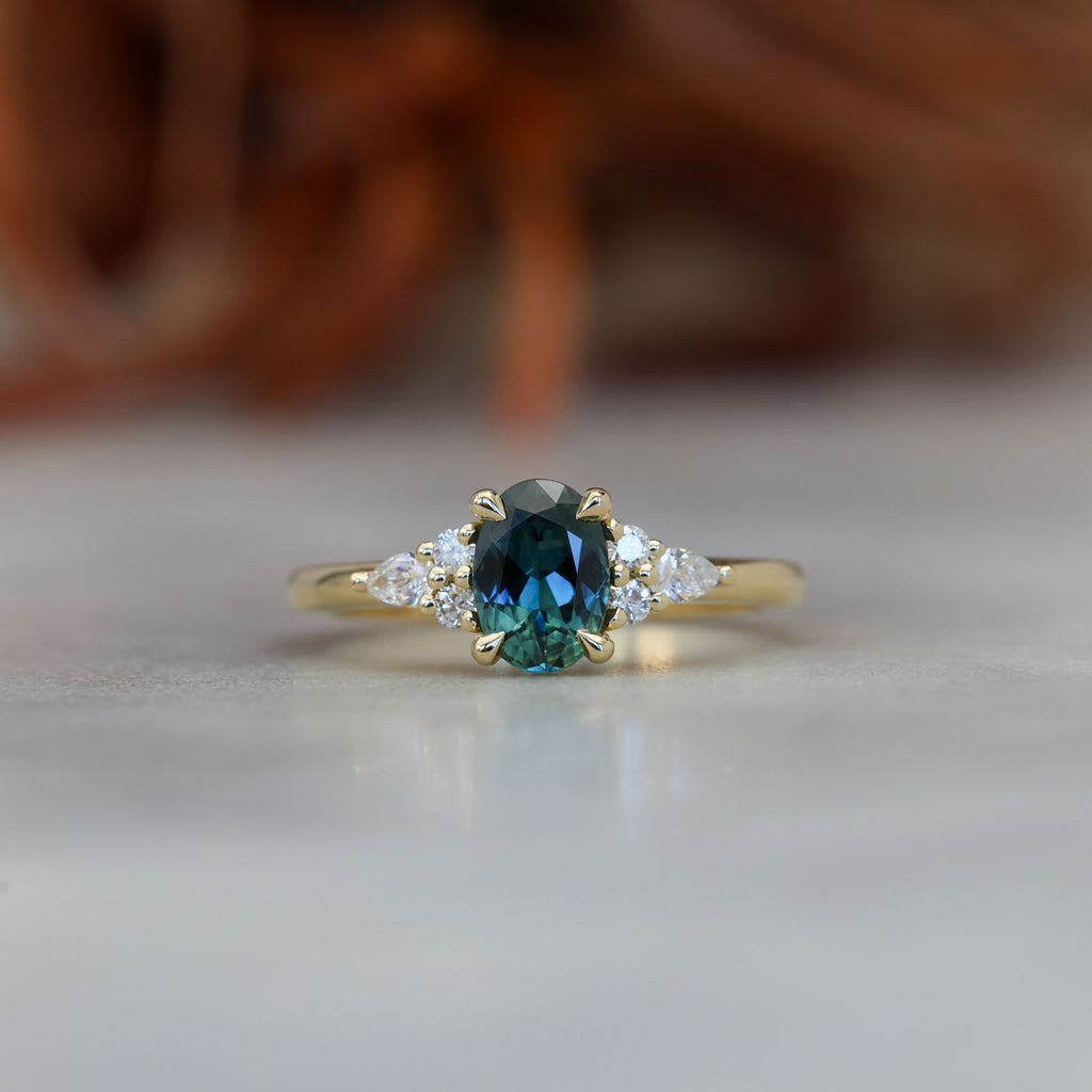 0.93ct oval cut Australian Sapphire and diamond engagement ring in yellow gold