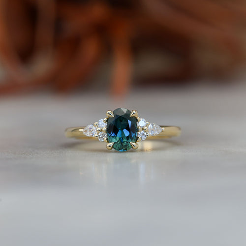 0.93ct oval cut Australian Sapphire and diamond engagement ring in yellow gold