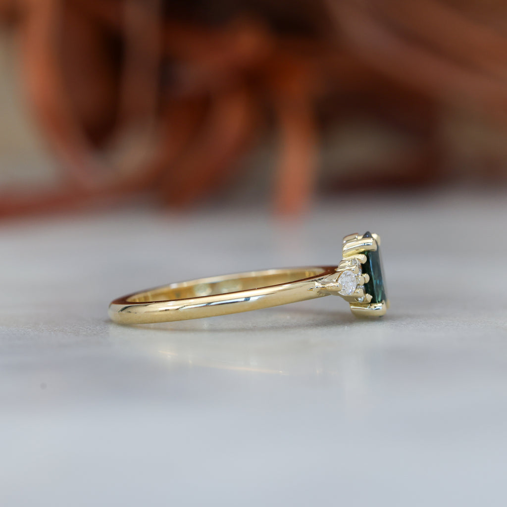 0.93ct oval cut Australian Sapphire and diamond engagement ring in yellow gold