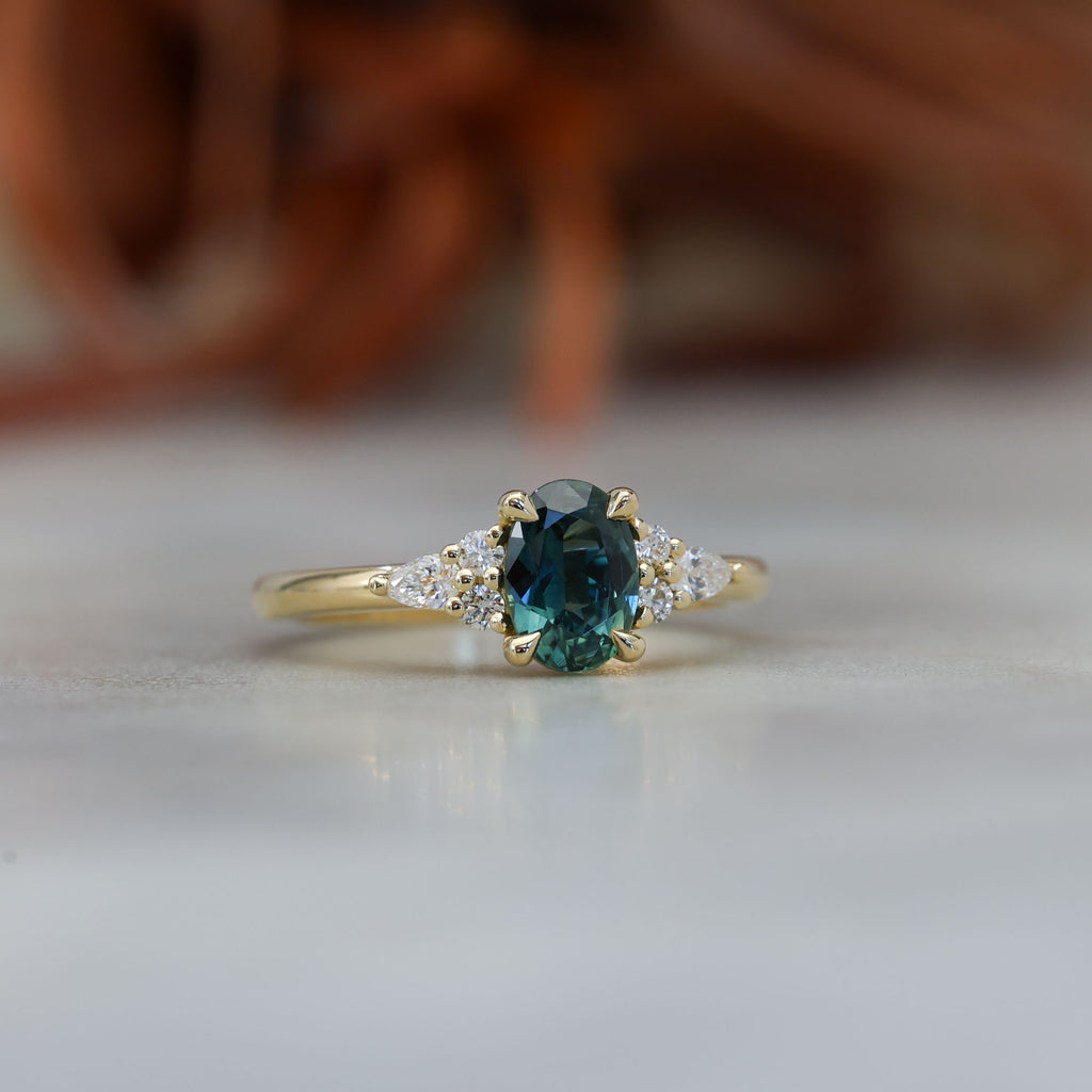 0.93ct oval cut Australian Sapphire and diamond engagement ring in yellow gold