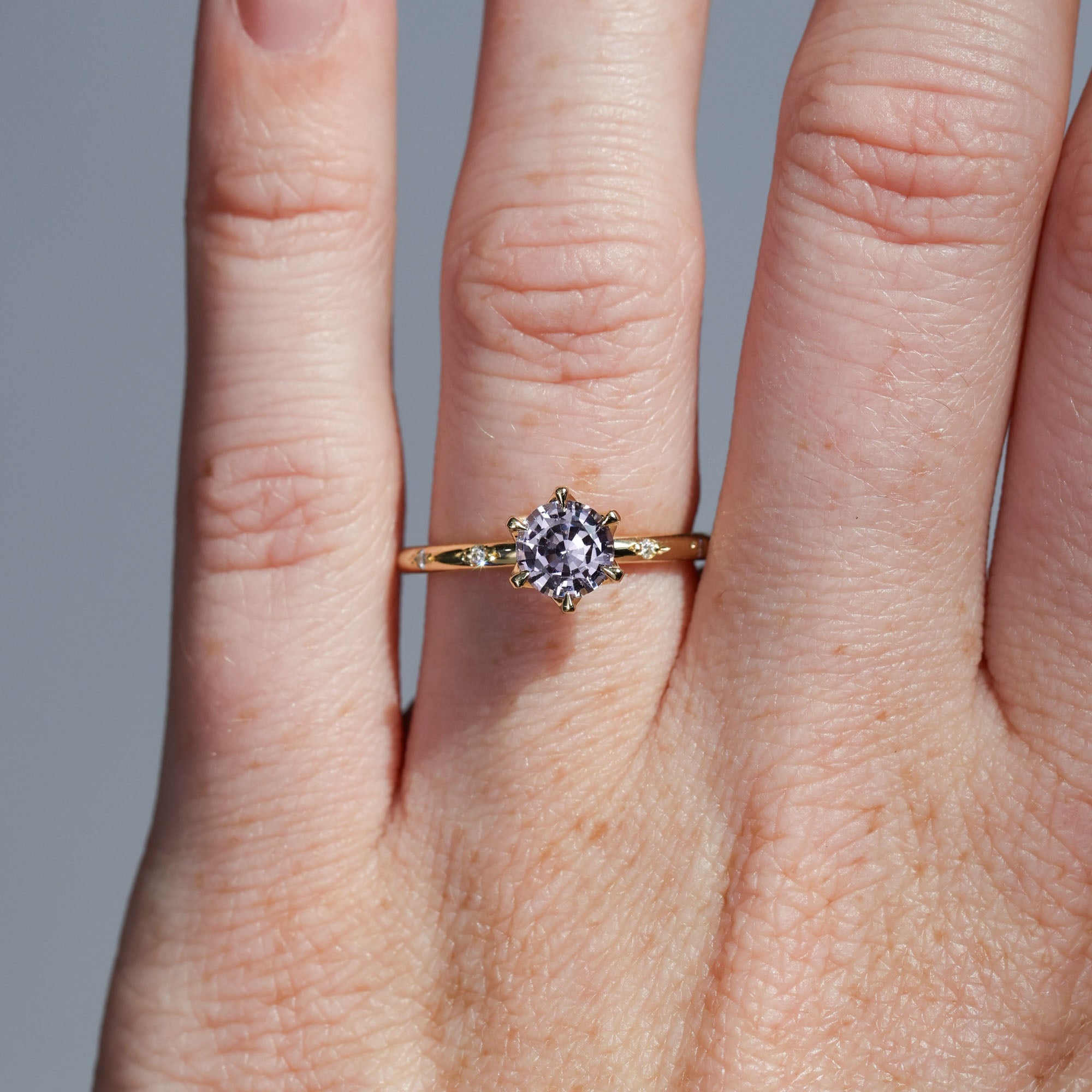 0.94ct Pink Madagascan and engagement ring with diamond band on hand