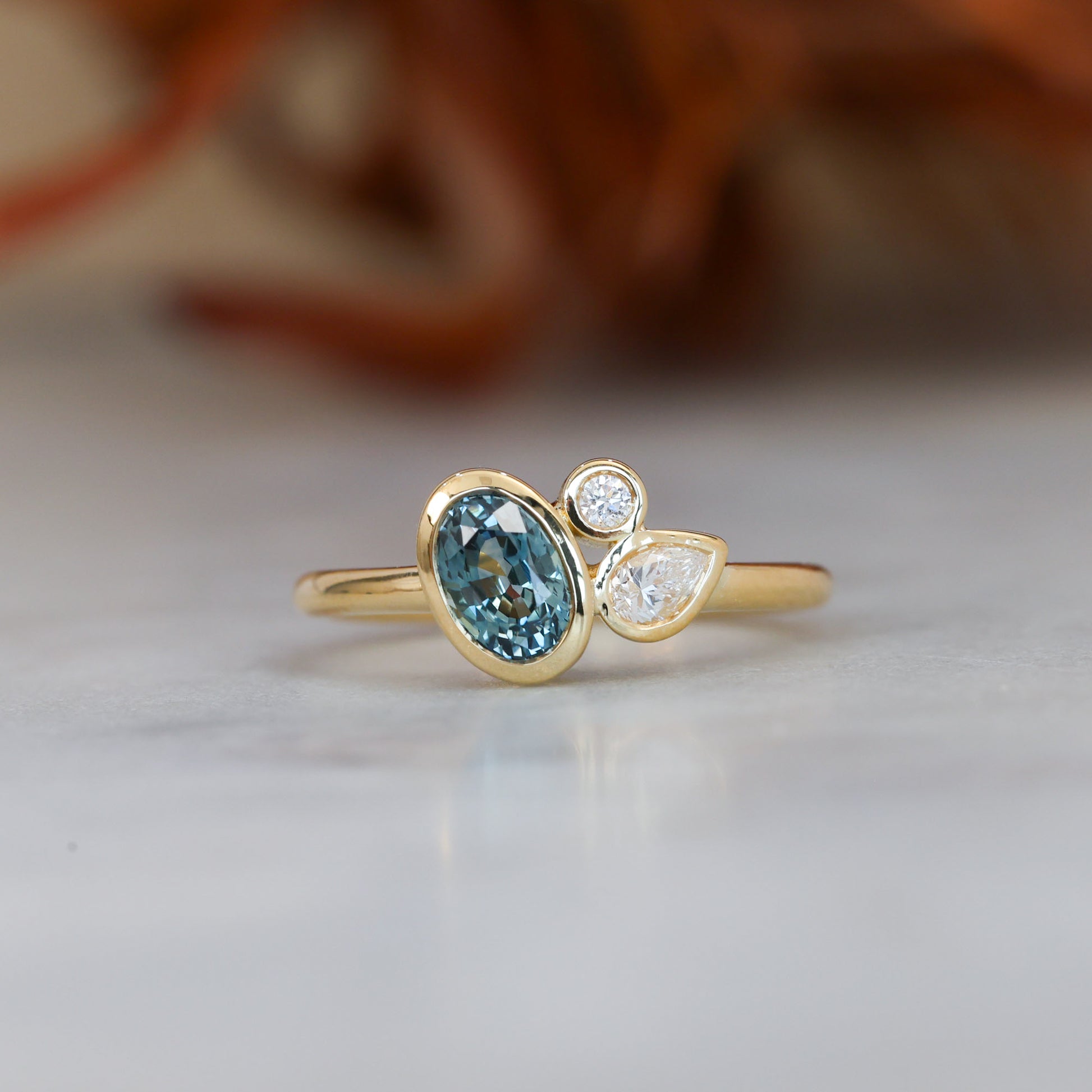 BRIDIE | 0.99CT OVAL MONTANA SAPPHIRE & DIAMOND ENGAGEMENT RING