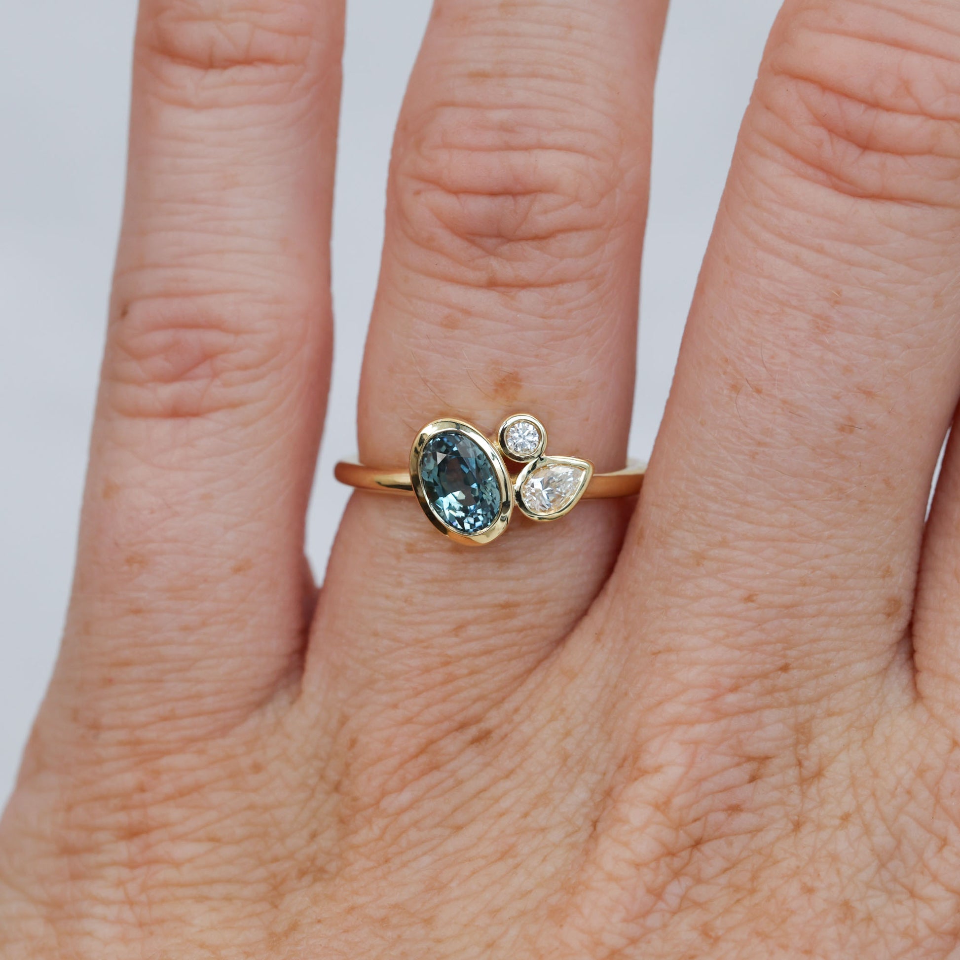 0.99ct oval cut natural montana sapphire and diamond engagement ring