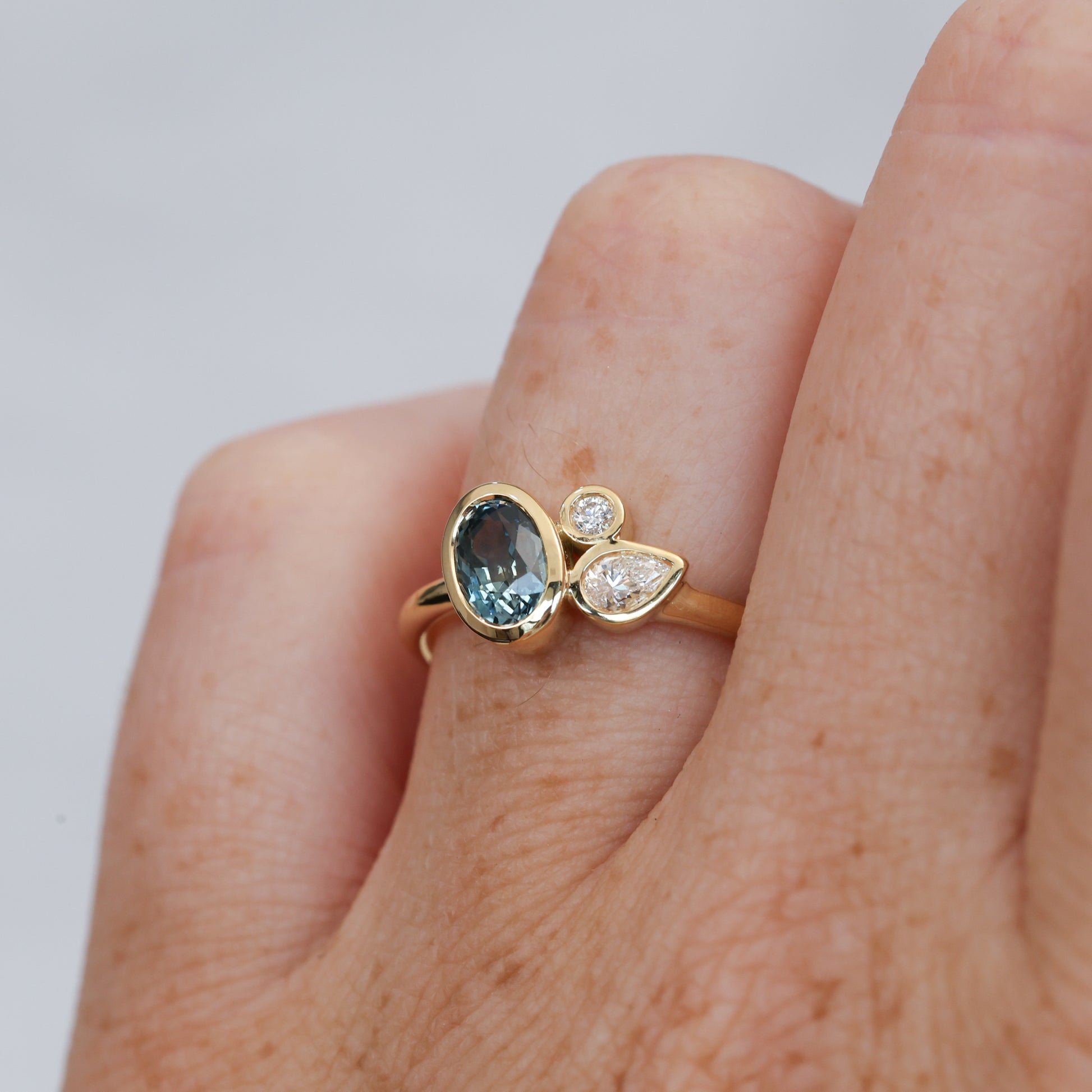 0.99ct oval cut natural montana sapphire and diamond engagement ring