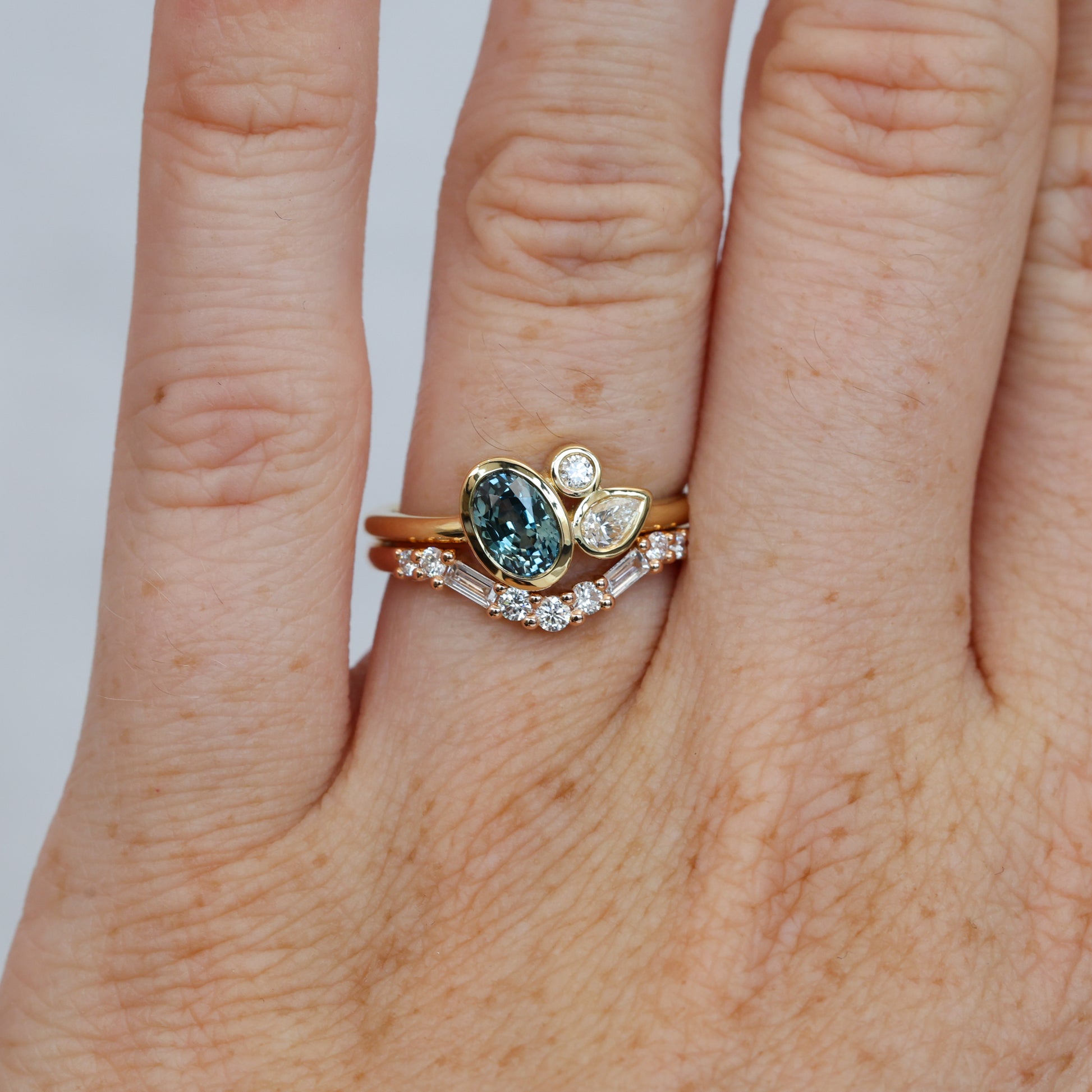 0.99ct oval cut natural montana sapphire and diamond engagement ring with wedding band