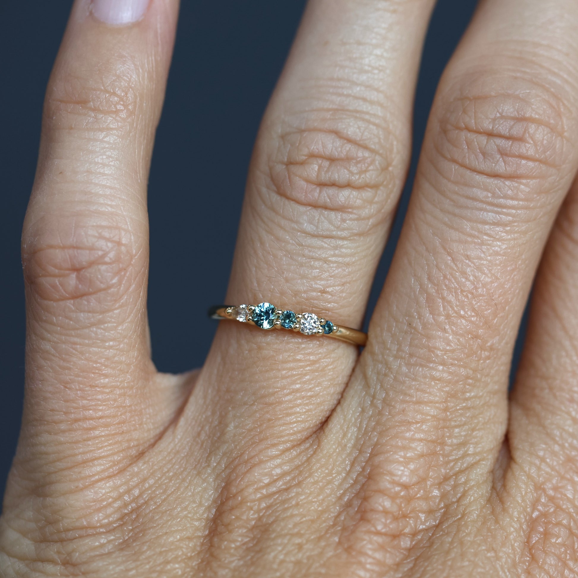 AUSTRALIAN ORIGINS / DIAMOND & SAPPHIRE CLUSTER RING